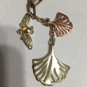 Fossil brand ginkgo leaf necklace. Multi colored metals